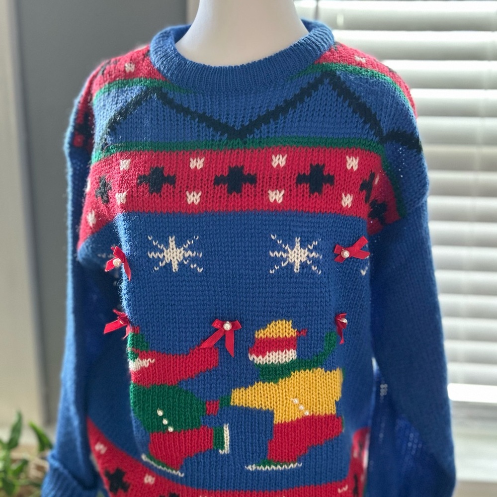 Festive Blue Holiday Sweater with Red and Yellow Accents